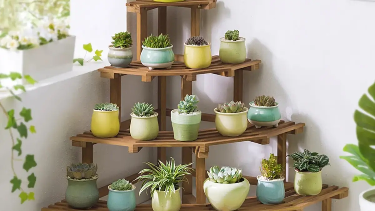 4 Tier Multifunctional Tall Tiered Wood Outdoor Plant Stand Display Shelf Rack Natural holding multiple potted plants on a patio or balcony.