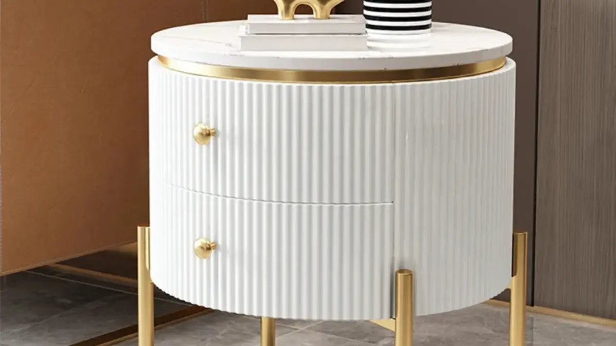Yelly 21" round side table with faux marble top and gold accents, featuring two storage drawers, shown in a modern living room setting.